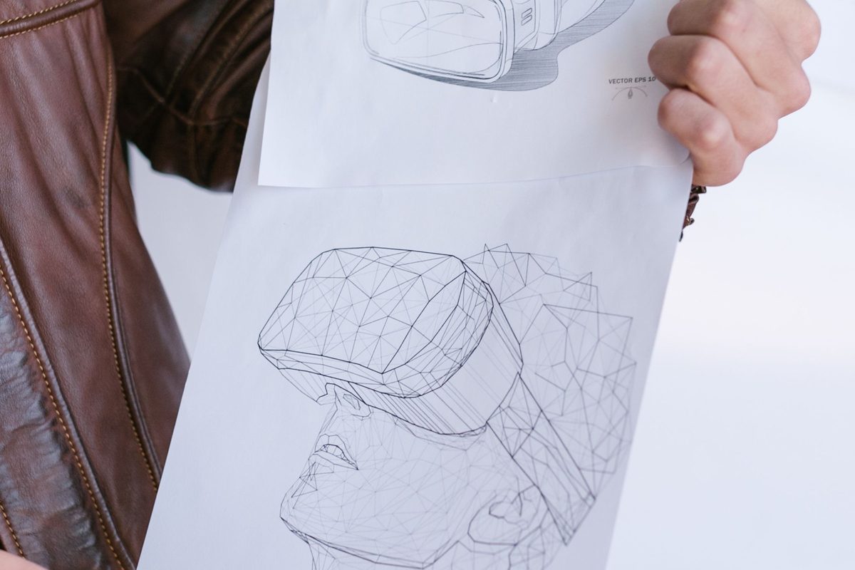 Hand-drawn product design concept sketches and a wireframe model on paper